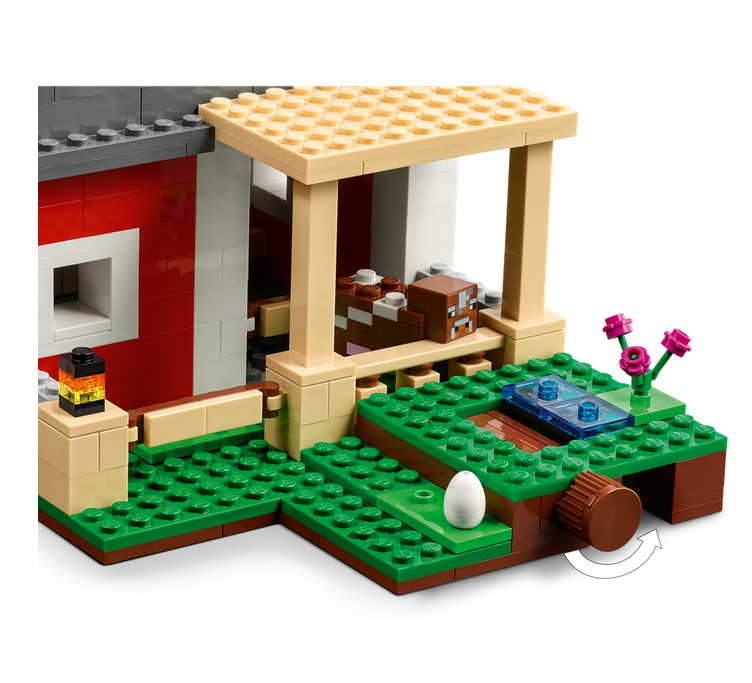 LEGO Minecraft The Red Barn playset showing barn porch, animal pen, vegetables, and a rotating potato feature.