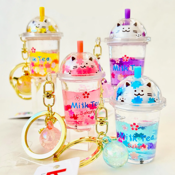 Kitty Boba Milk Keychain featuring colorful milk tea cups with cute cat faces and keyrings for bags or keys.