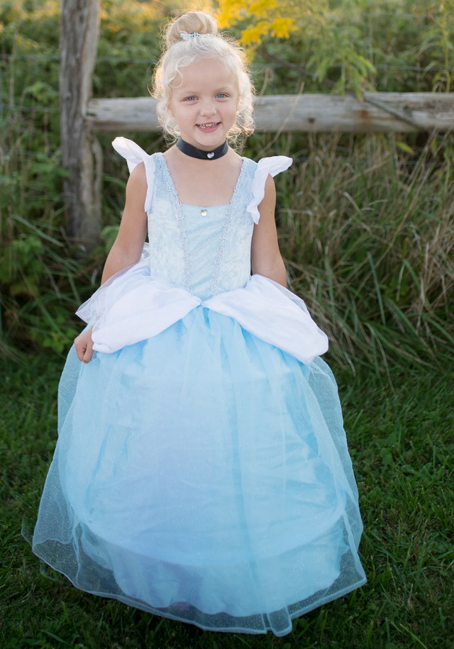 Deluxe Cinderella Gown | Size 5-6 worn by a smiling girl outdoors, featuring hoop skirt and layered blue fabric.
