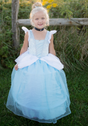 Deluxe Cinderella Gown | Size 5-6 worn by a smiling girl outdoors, featuring hoop skirt and layered blue fabric.