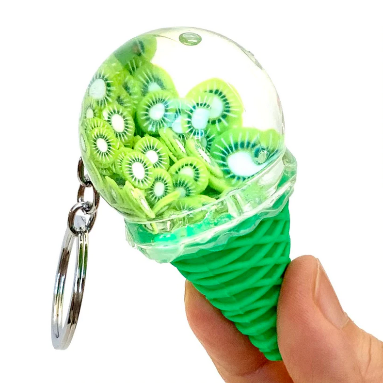 Fruit Icecream Keychain with green cone and clear top filled with detailed kiwi fruit slices, held in hand against white background.