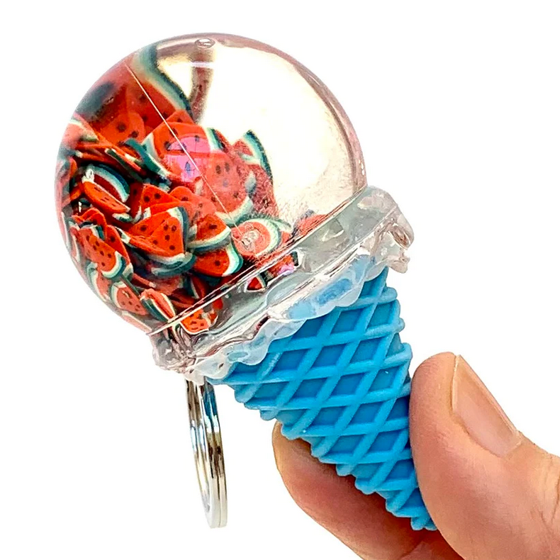 Hand holding a blue Fruit Icecream Keychain with watermelon slice details inside a clear ice cream scoop.