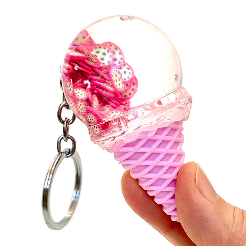 Fruit Icecream Keychain with pink ice cream cone and clear scoop filled with colorful sprinkles, held in hand.