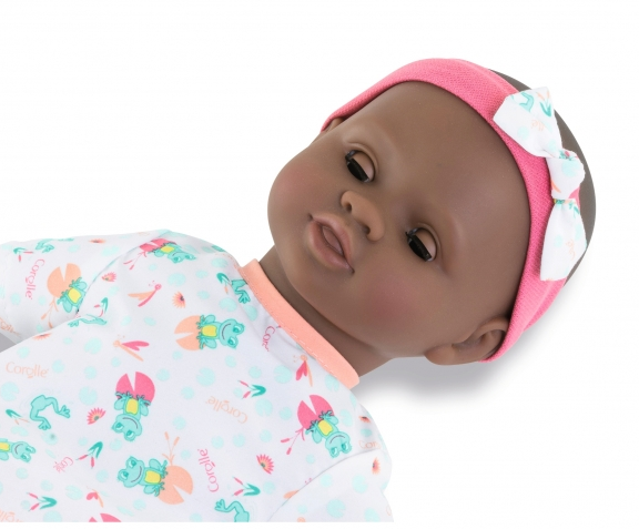 Bath Baby Alyzée doll wearing a frog-print outfit and pink headband with closed sleepy eyes.