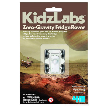 Fridge Rover toy in packaging showing white magnetic wind-up rover designed to move on refrigerator surfaces.