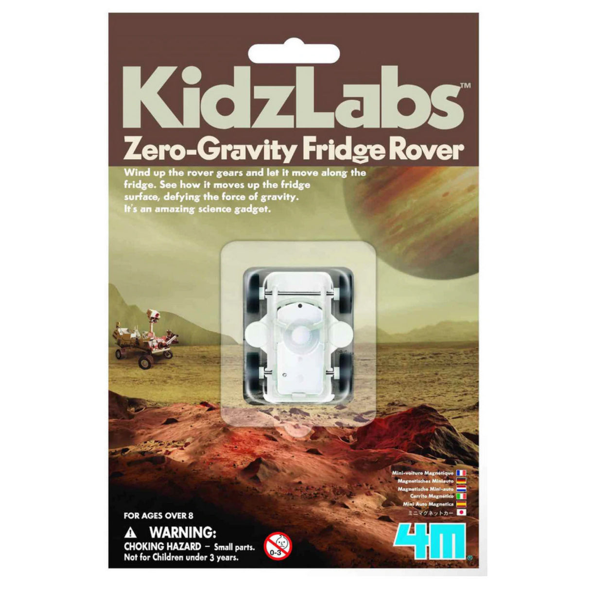 Fridge Rover toy in packaging showing white magnetic wind-up rover designed to move on refrigerator surfaces.