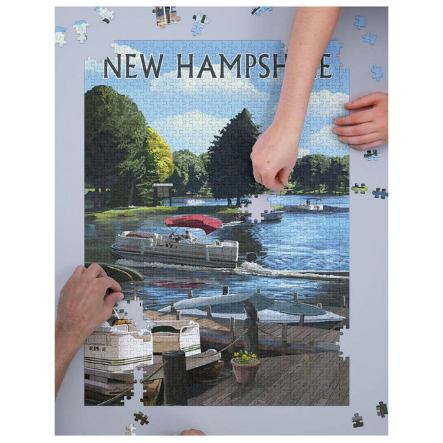 1000pc NH Pontoon & Lake Puzzle showing a scenic New Hampshire lake with pontoon boats in progress assembly.