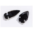 Two hand-crafted Arrowhead Obsidian pieces made from volcanic glass showing traditional carving details on white background