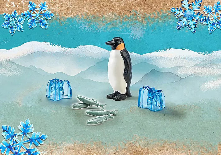 Wiltopia Emperor Penguin toy with fish and ice accessories on icy Arctic-themed background for kids.