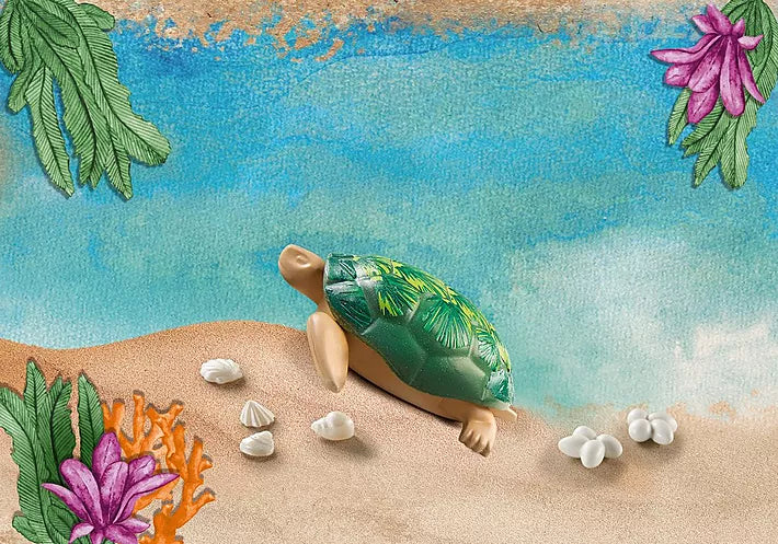Wiltopia Giant Turtle toy with seashells and eggs on a sandy beach background with tropical leaves and flowers.