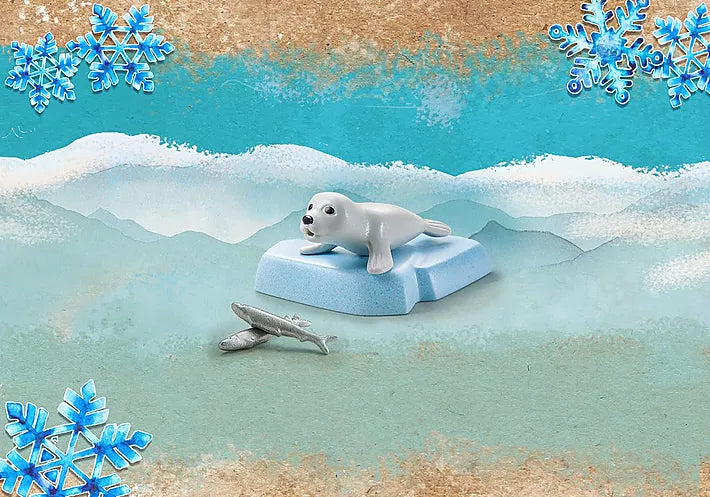 Wiltopia Seal toy with baby seal on ice floe and fish, part of an eco-friendly educational animal playset.