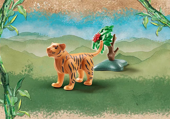 Wiltopia Baby Tiger toy figure with accessories set in a painted jungle background for imaginative play.