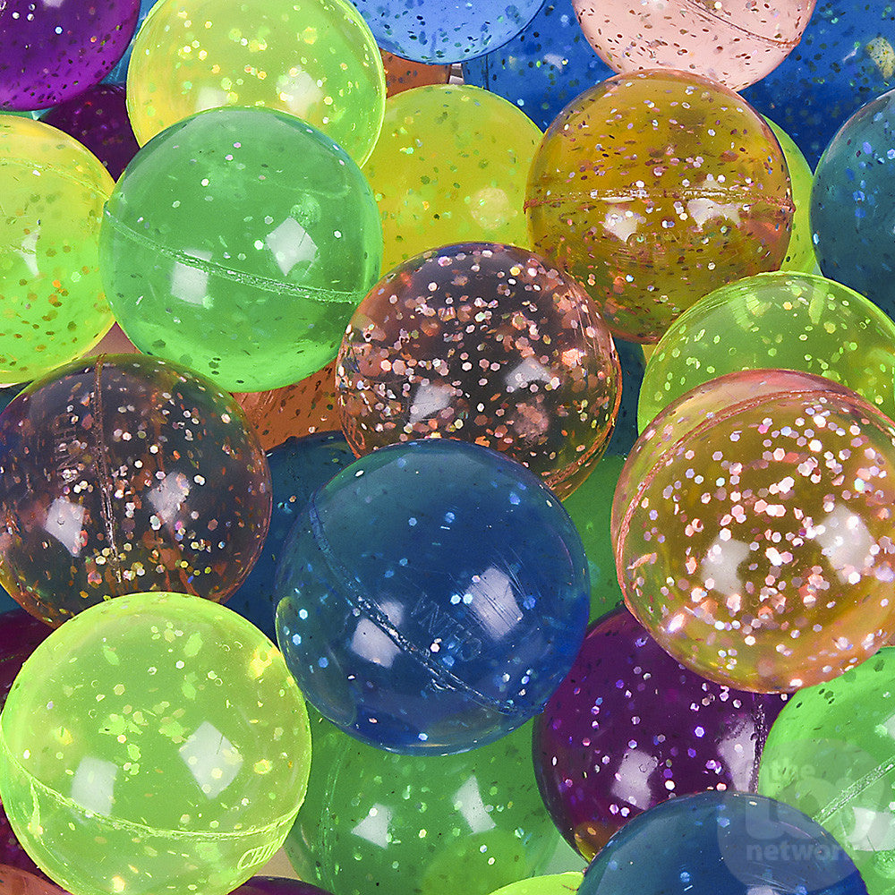 Assorted colorful Glitter Bouncy Ball close-up showing shiny, durable, pocket-sized balls with sparkling glitter inside.
