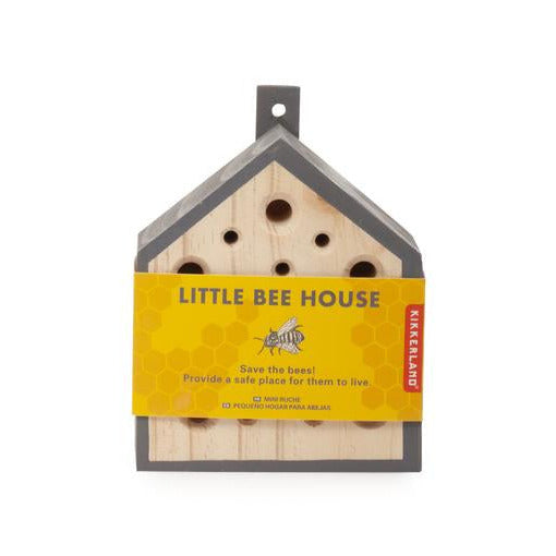 Little Bee House wooden bee habitat with multiple holes, designed to invite pollinators to gardens and backyards.
