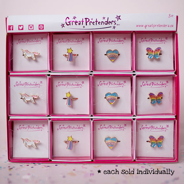 Rainbow Ring assorted styles including unicorn, star, heart, and butterfly designs in individual boxes for kids 3+.