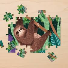 48pc Sloth Mini Puzzle showing a partially completed three-toed sloth image with green leaves on wooden surface.