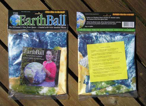 Inflatable Earth Ball packaged with NASA satellite images, showing the Earth with glowing city lights, deflated in a bag.