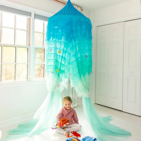 Light-Up Mermaid Canopy in oceanic blue with LED lights and appliqué shells creating a magical underwater play space.