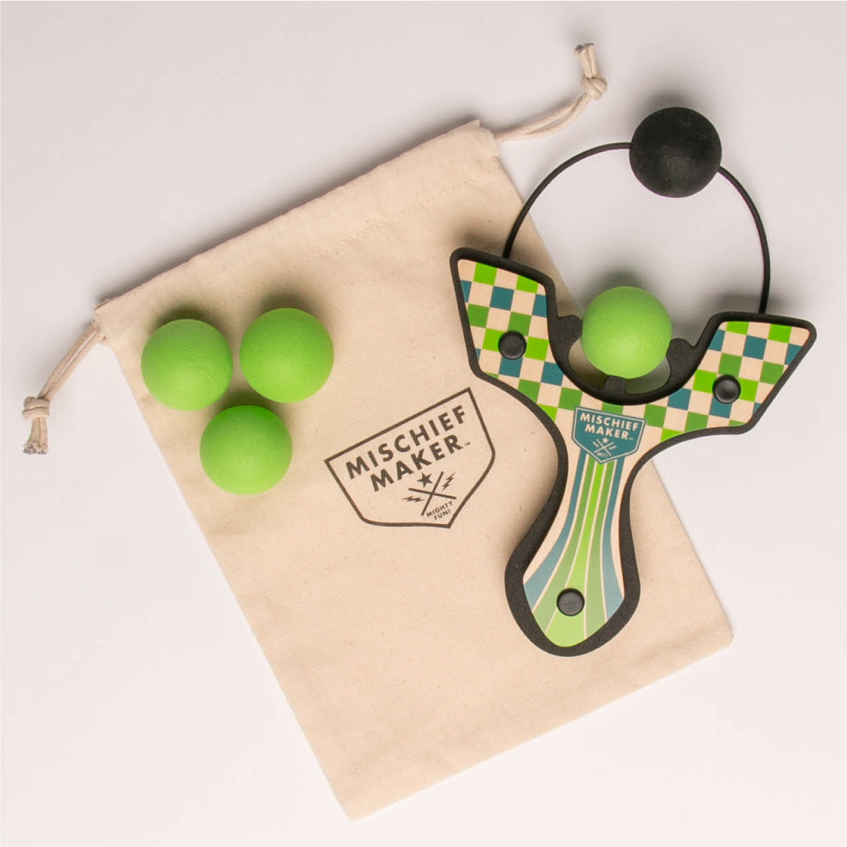 Slingshot Green Checkered handmade wooden slingshot with green foam balls and storage bag for kids ages 4 and up.
