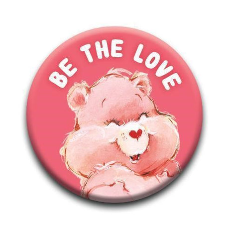 Be the Love Care Bear Button with a smiling pink bear and white text on a vibrant pink background pinback button.