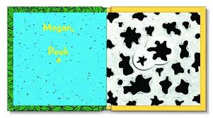 Peek a Who? colorful board book with die-cut windows showing black and white cow spots for toddlers.