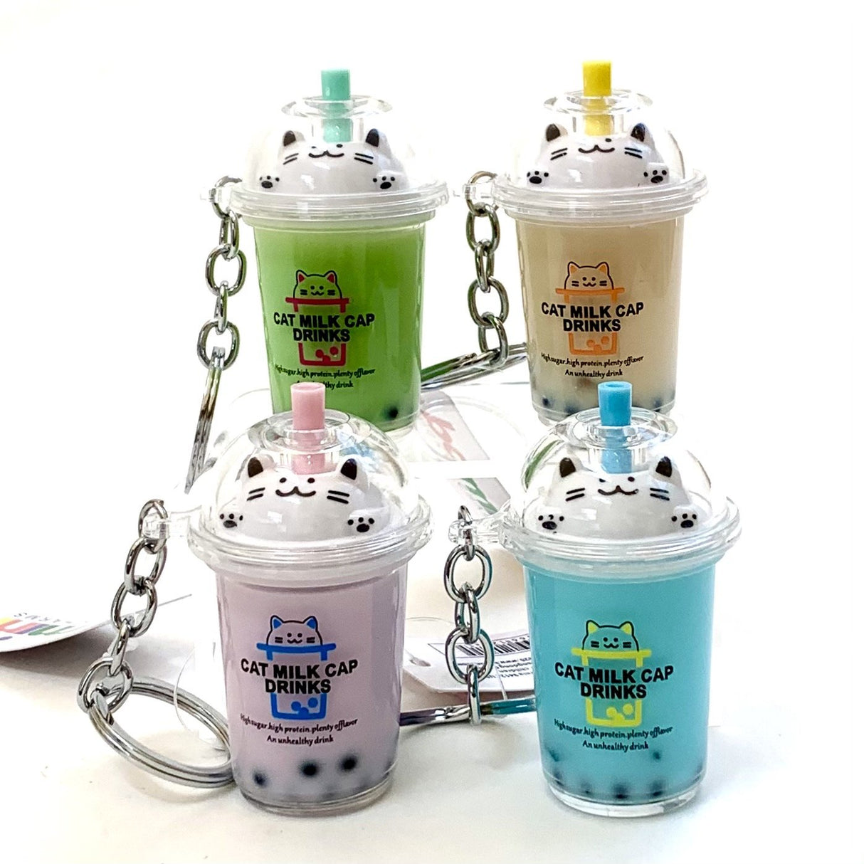 Cat Boba Tea KeyChain featuring colorful cat-themed boba drink designs with key ring and clip, assorted colors.