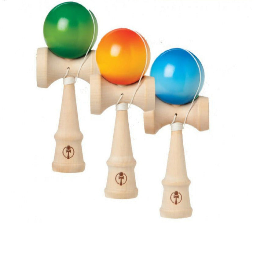 Wooden Fade Kendama set with hardwood construction and colorful fade-out starburst balls in green, orange, and blue.
