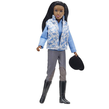 Schooling Rider doll dressed in breeches, vest, tall boots, holding helmet, ready for horse schooling activities.