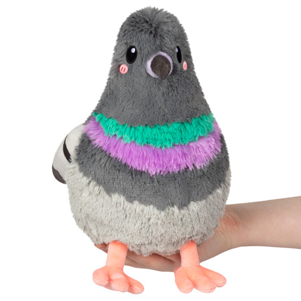Soft and colorful Pigeon Mini plush held in hand, featuring gray, green, and purple polyester fibers.