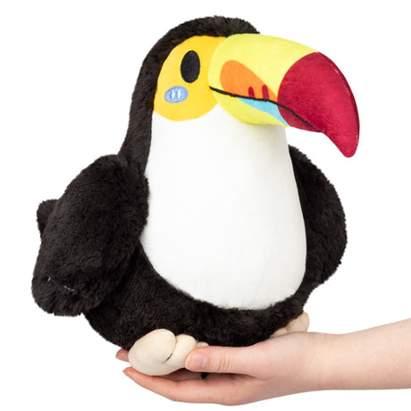 Toucan Mini plush toy with colorful beak held in hand, soft polyester fiber, perfect cuddly pet for all ages.