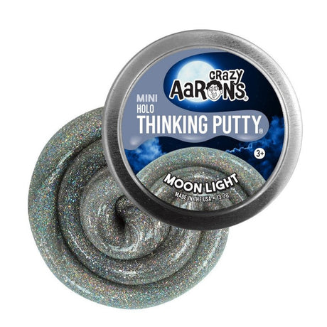 Mini Holo Moon Light Thinking Putty in silver with holographic glitter in a round tin container.