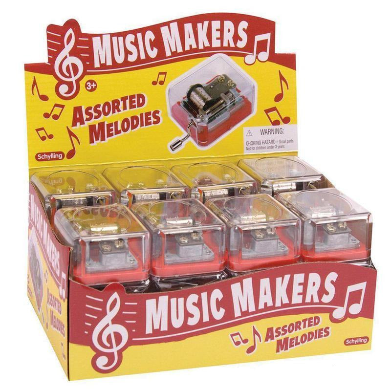 Mechanical Music Box display with assorted melodies in clear cases, pocket-sized classical music mechanism for ages 3 and up.