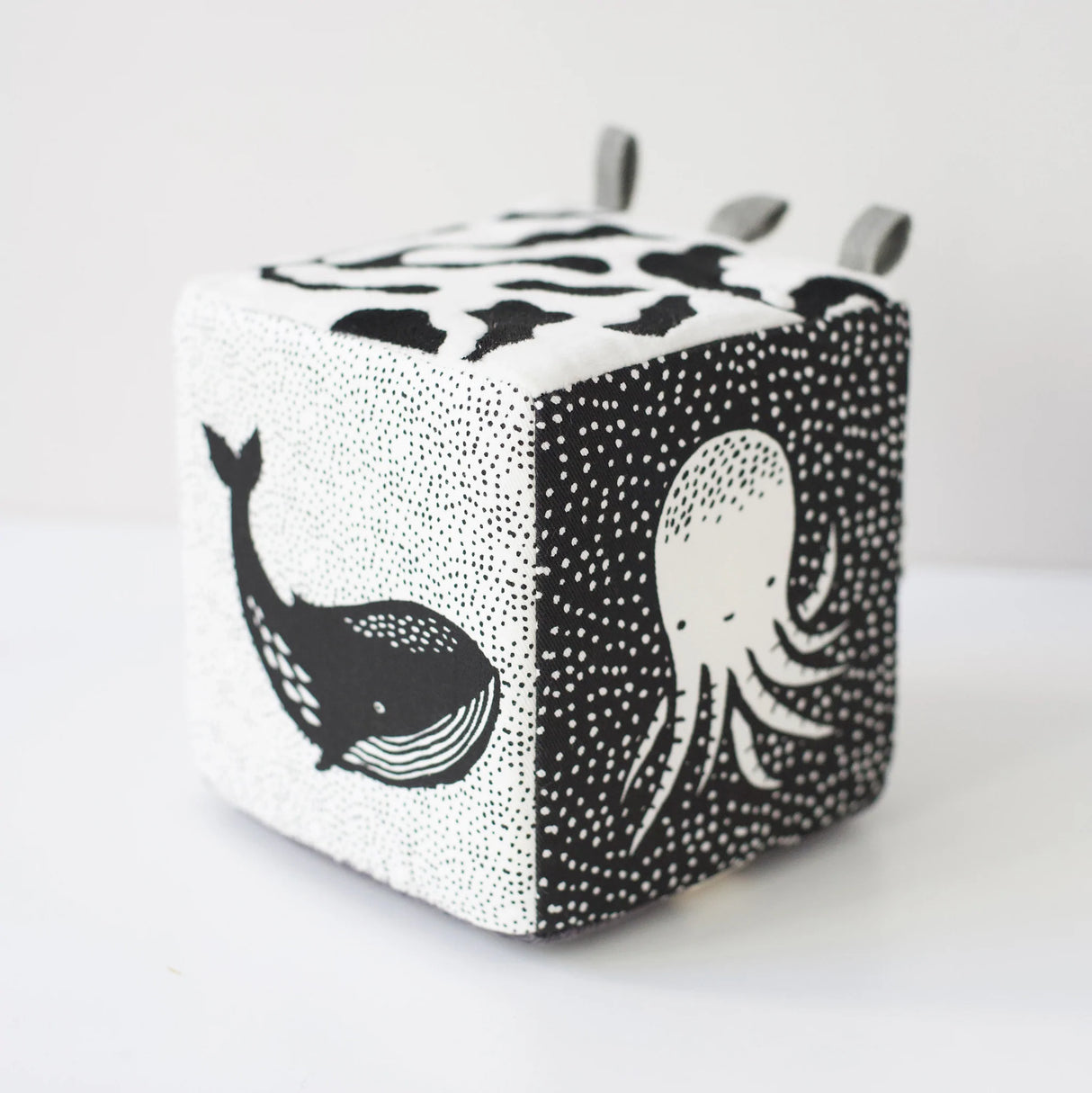 Organic Soft Block | Ocean with black and white whale and octopus illustrations on soft fabric cube.