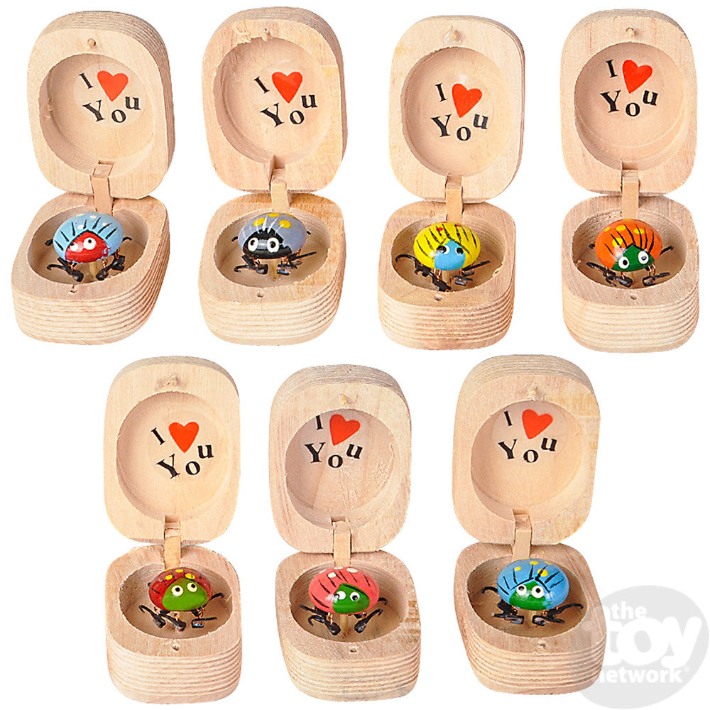 Bug in Box wooden cases with assorted colorful bugs, moveable legs, and "I love you" message inside.