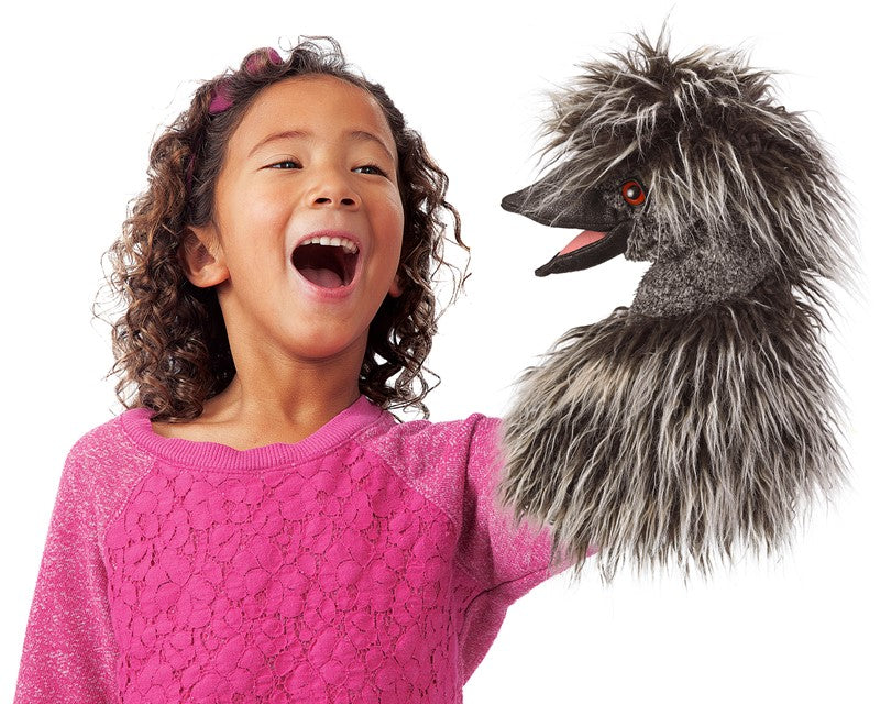 Child playing with an Emu Stage Puppet featuring a two-toned plush head and movable beak for ages 3 and up.
