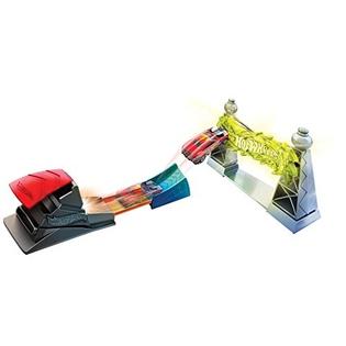 Hot Wheels Classic Stunts playset with red launcher and car jumping through electric tower stunt on orange track.