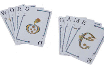 Quiddler card game showing word and game cards with decorative musical note illustrations on white background.