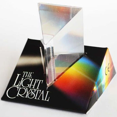 Crystal Prism positioned on black base showing colorful rainbow reflections in natural sunlight.