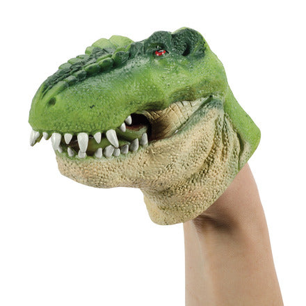 Green Dino Rubber Puppet T-Rex head with sharp teeth and red eye on a hand for playful dinosaur fun.