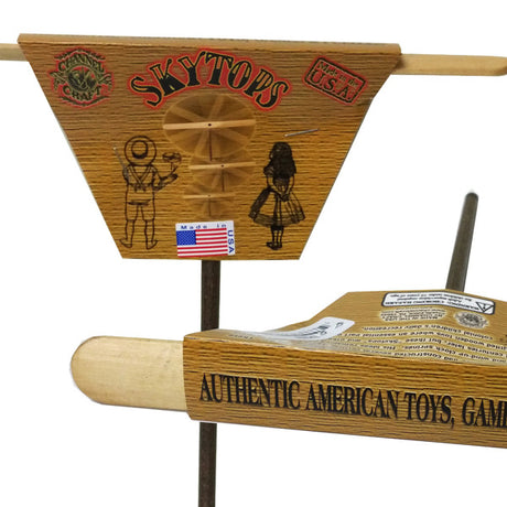 Skytops | Rainbow wooden hand prop with vintage astronaut and girl designs, made in the USA, natural finish toy.