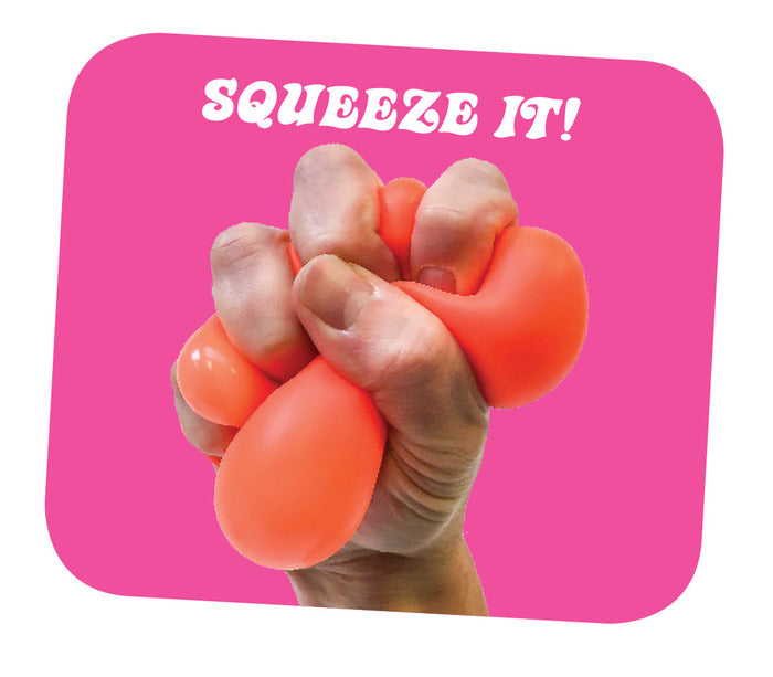 Hand squeezing an orange NeeDoh Groovy Glob stress ball against a pink background with text "Squeeze It!