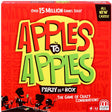 Apples to Apples party game box with colorful logo and silhouettes of people playing cards on red background.
