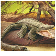 Alligator Puppet with soft velour body and plastic teeth posed on a riverbank log in a natural setting.