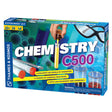 Chemistry 500 experiment kit box showing test tubes, safety goggles, and colorful chemical reaction graphics.