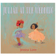 Cover of Julian at the Wedding showing two joyful girls dancing under hanging leaves and flowers.