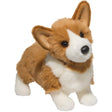 Corgi Ingrid plush toy with fluffy tan and white fur, upright jumbo ears, and stumpy corgi paws, 16 inches tall.