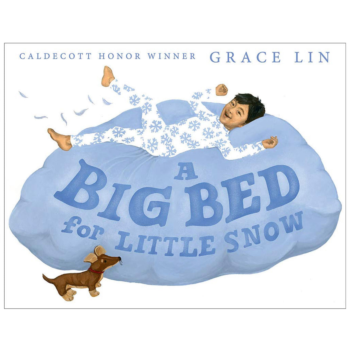 A child jumping on a large blue bed with snowflake pajamas and dog nearby in A Big Bed for Little Snow.