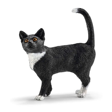 Cat Standing figurine showing a black and white cat with alert eyes and raised tail in a graceful posture.