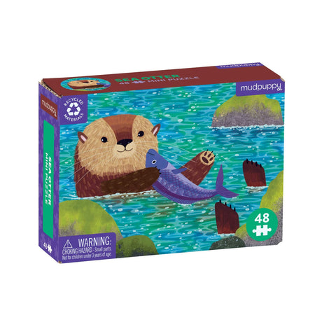 48pc Sea Otter Mini Puzzle box featuring an illustrated sea otter holding a fish in blue-green water with rocks.