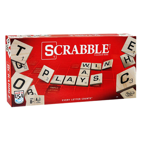 Scrabble board game box with wooden letter tiles spelling PLAY WIN WAYS for 2-4 players aged 8+ in classic word game.